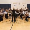 Sarah conducts the orchestra at ChamberStrings 2016